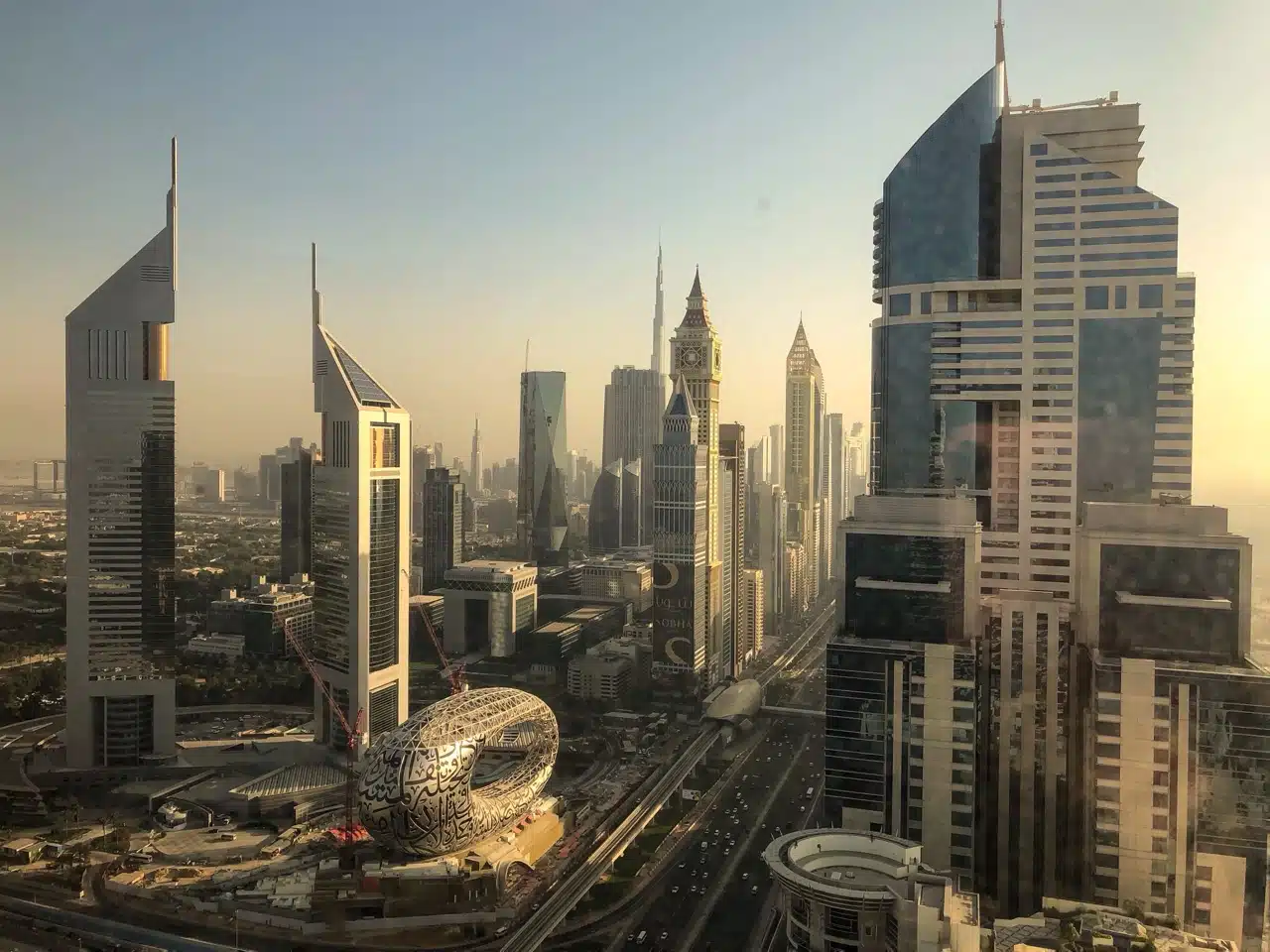 Street-level view of Jumeirah Garden City Al Satwa showing new mid-rise residential buildings under construction alongside completed developments